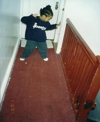 Young Bashy wearer standing on a carpeted staircase